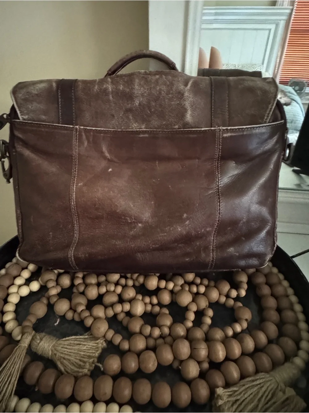 Samsonite brown leather flapover messenger bag with dual buckle straps